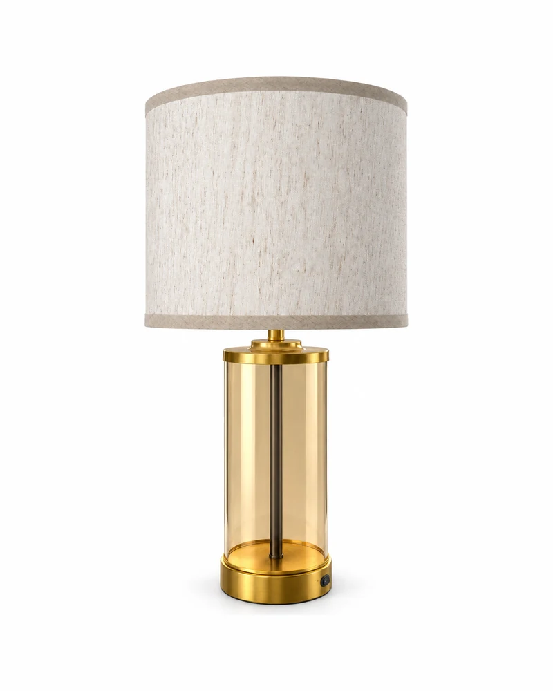 Cordless table lamp in a gold finish on a wooden surface