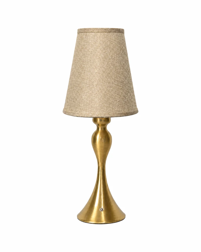 Table lamp with a gold turned column and a tapered fabric shade